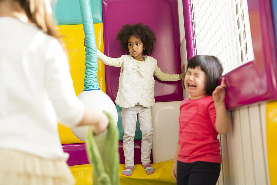 Little girl crying in the playroom